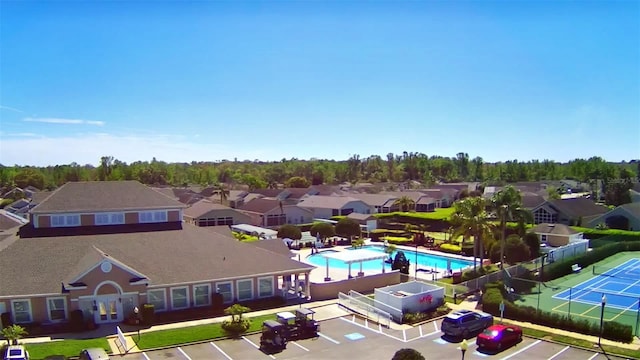 birds eye view of property with a residential view