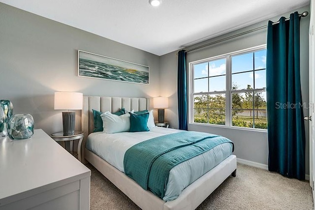 1861 Walnut Creek Dr, Kissimmee, FL 34744 - bedroom with light carpet and baseboards