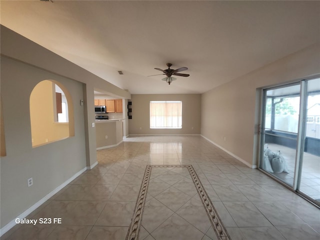 1346 Rolling River Rd, Deland, FL 32720 - unfurnished living room featuring ceiling fan, baseboards, and light tile patterned flooring