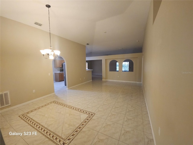 1346 Rolling River Rd, Deland, FL 32720 - unfurnished room with a chandelier, high vaulted ceiling, arched walkways, and baseboards