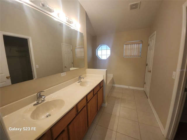 1346 Rolling River Rd, Deland, FL 32720 - full bathroom with double vanity, tile patterned flooring, baseboards, a closet, and a tub