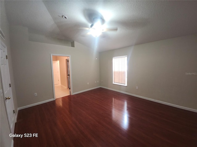 1346 Rolling River Rd, Deland, FL 32720 - unfurnished bedroom with wood finished floors, baseboards, lofted ceiling, a textured ceiling, and ceiling fan