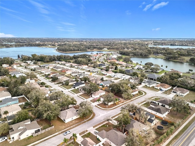 birds eye view of property with a residential view and a water view