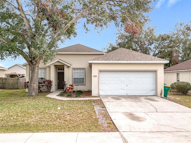 ranch-style home featuring a garage, fence, a front lawn, and stucco siding