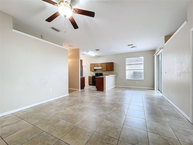 unfurnished living room featuring visible vents, ceiling fan, baseboards, and light tile patterned floors