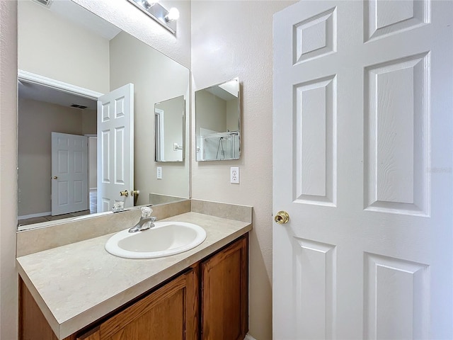 bathroom featuring visible vents and vanity