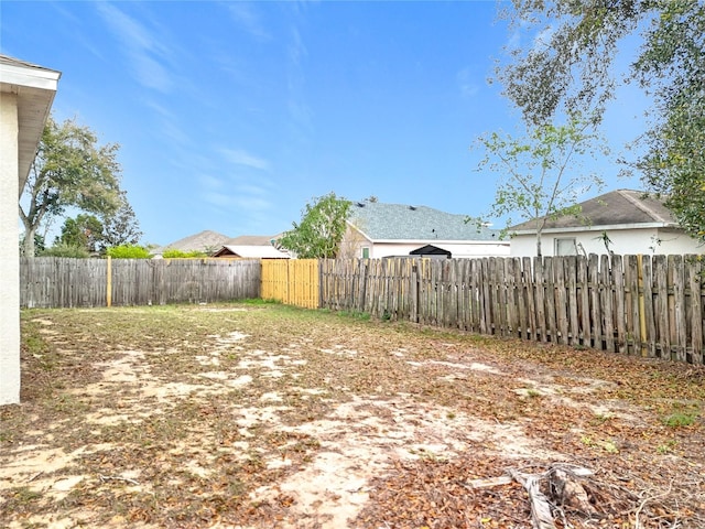 view of yard with a fenced backyard