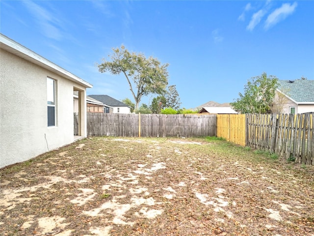 view of yard with a fenced backyard