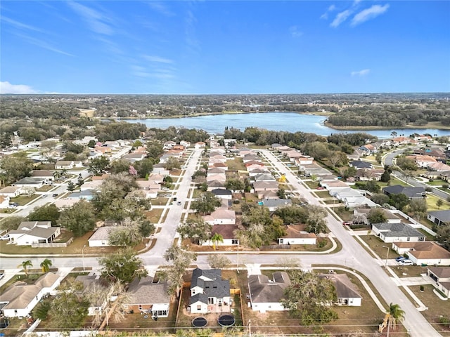 birds eye view of property featuring a water view and a residential view