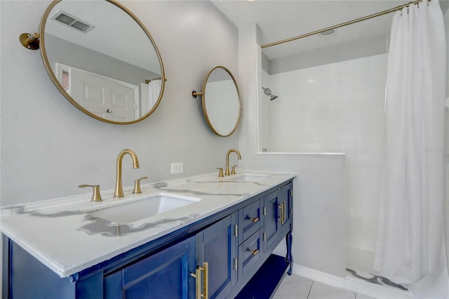 bathroom with double vanity, visible vents, a sink, a shower with curtain, and tile patterned floors