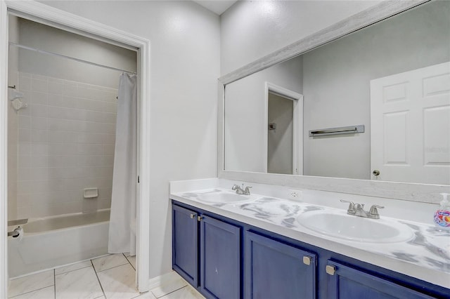 bathroom featuring shower / bath combo, marble finish floor, a sink, and double vanity