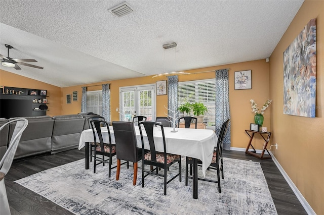 dining room with visible vents, baseboards, vaulted ceiling, french doors, and dark wood-style floors