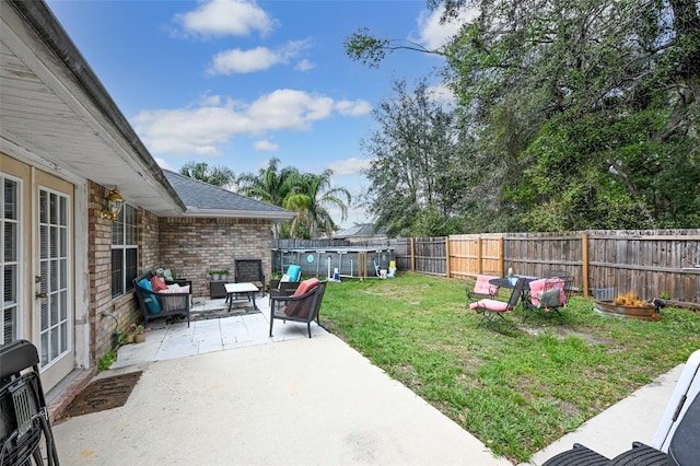 view of yard featuring a patio area and a fenced backyard