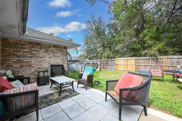 view of patio with a fenced backyard and an outdoor hangout area