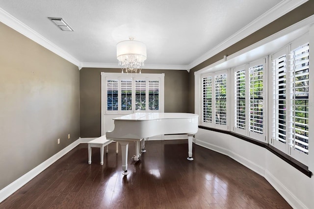 unfurnished dining area featuring crown molding, wood-type flooring, visible vents, and baseboards