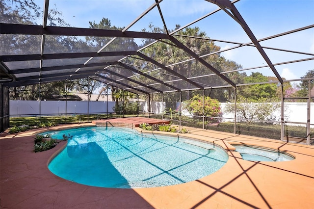 view of swimming pool with a lanai, a fenced backyard, and a patio