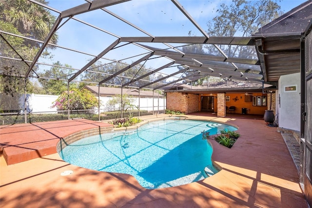 view of swimming pool featuring a fenced in pool, a lanai, a patio, and fence