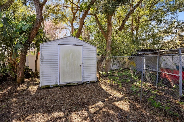 view of shed with a fenced backyard