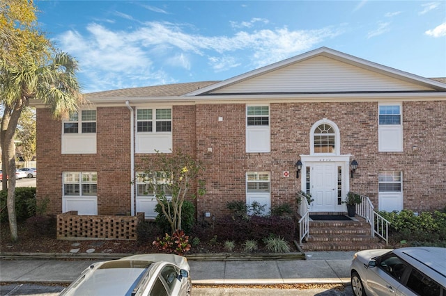 view of front of home with brick siding