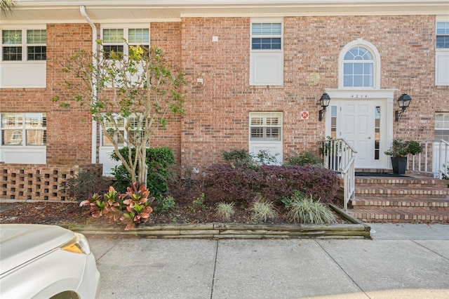 view of front of property featuring brick siding