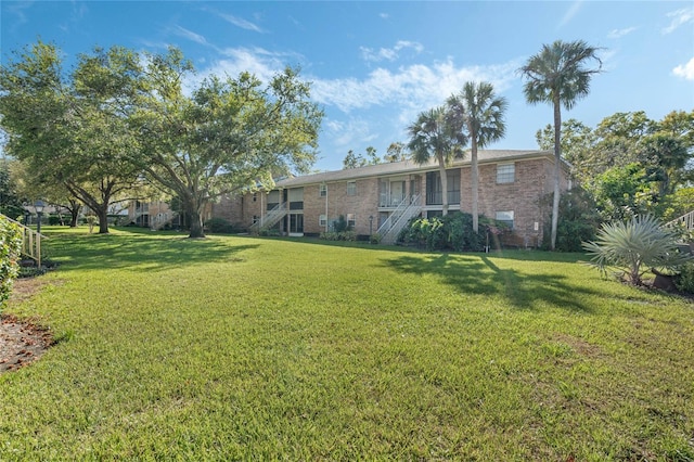 4214 Lake Underhill Rd Unit A, Orlando, FL 32803 - view of grassy yard with stairs