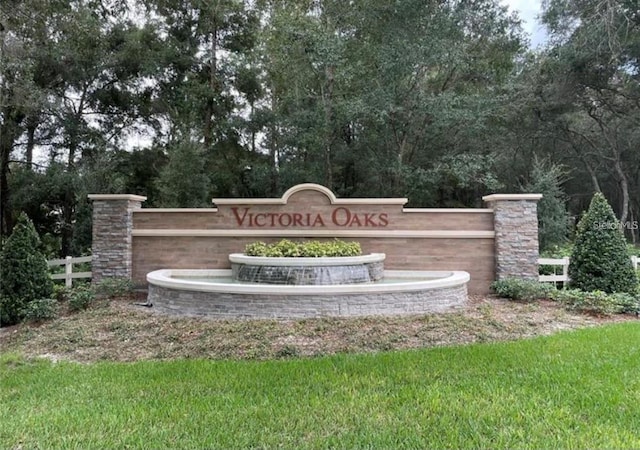 community sign with fence