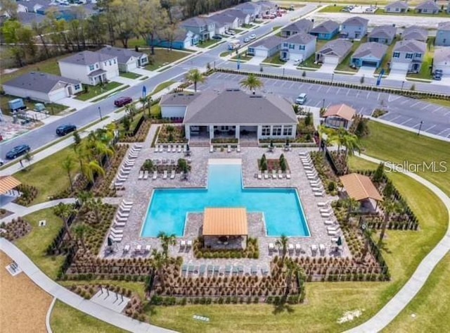 birds eye view of property with a residential view