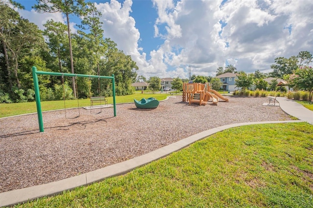 communal playground featuring a lawn