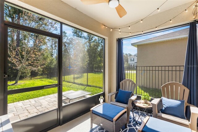 sunroom / solarium with ceiling fan