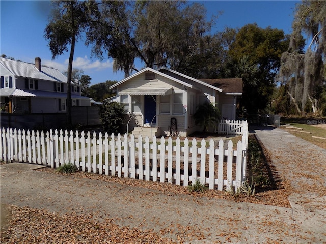 bungalow with a fenced front yard