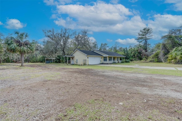 exterior space featuring driveway and an attached garage