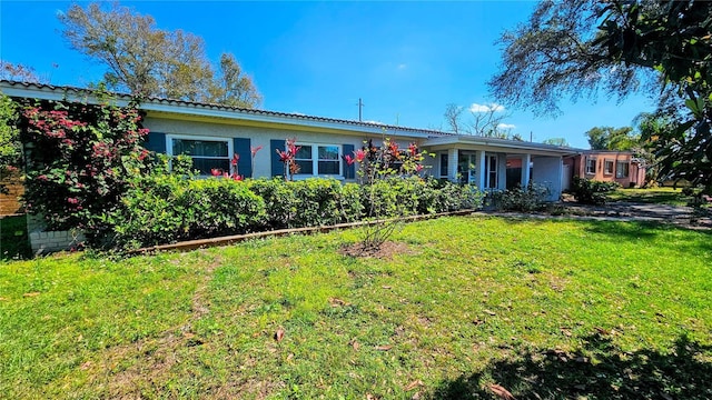 single story home featuring a front yard and stucco siding