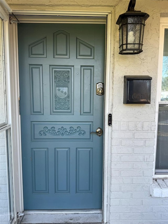 doorway to property featuring a porch