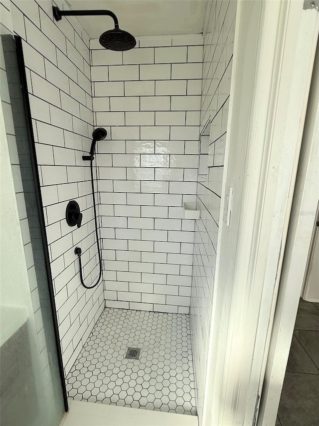 bathroom with a shower stall