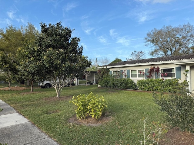 ranch-style home featuring a front yard