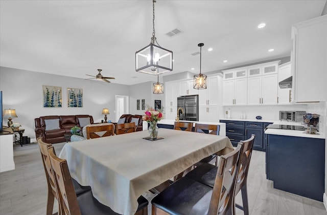 dining room with visible vents, baseboards, ceiling fan, light wood-type flooring, and recessed lighting