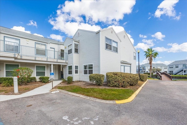 2540 Woodgate Blvd Unit 106, Orlando, FL 32822 - view of front of property featuring uncovered parking