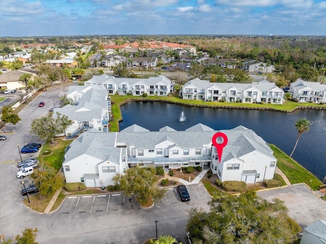 aerial view featuring a residential view and a water view