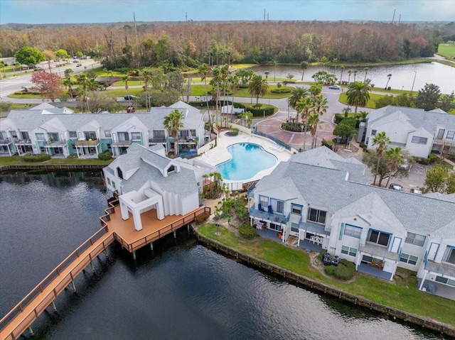 bird's eye view featuring a water view and a residential view