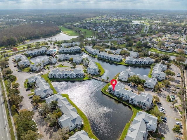 bird's eye view featuring a water view and a residential view