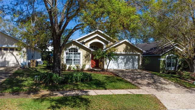 view of front of home with an attached garage and concrete driveway