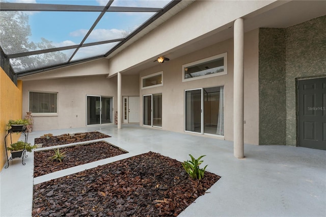 exterior space with a lanai, a patio area, and stucco siding