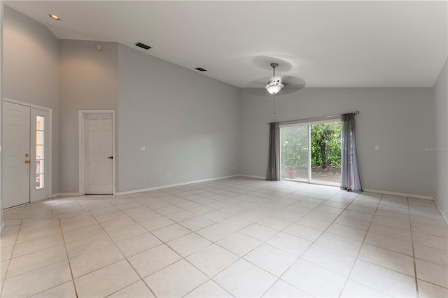 spare room featuring light tile patterned floors, ceiling fan, visible vents, and baseboards