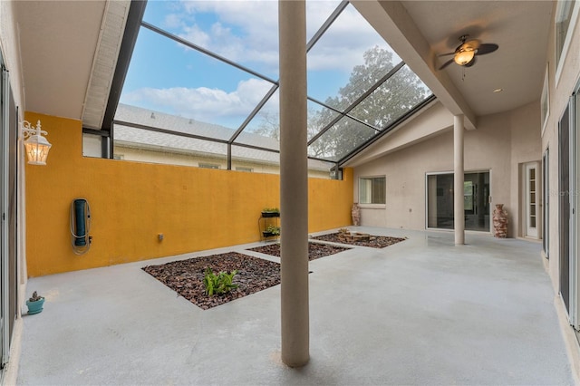 view of patio with glass enclosure