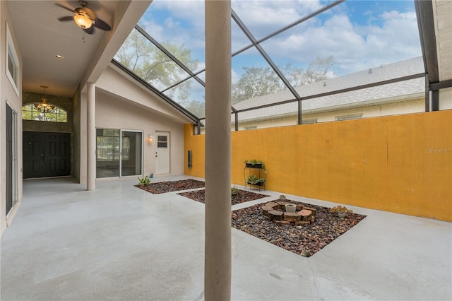 view of patio / terrace featuring glass enclosure