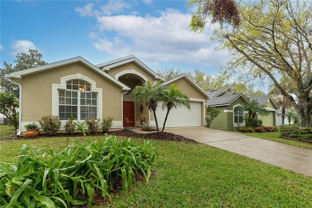 ranch-style home featuring driveway, an attached garage, a front yard, and stucco siding