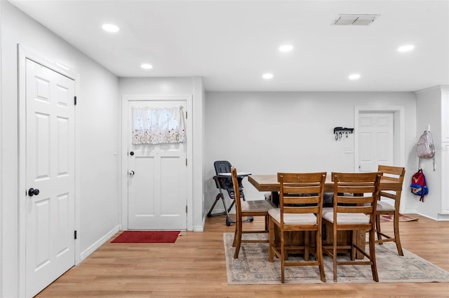 dining room with visible vents, baseboards, light wood-style flooring, and recessed lighting