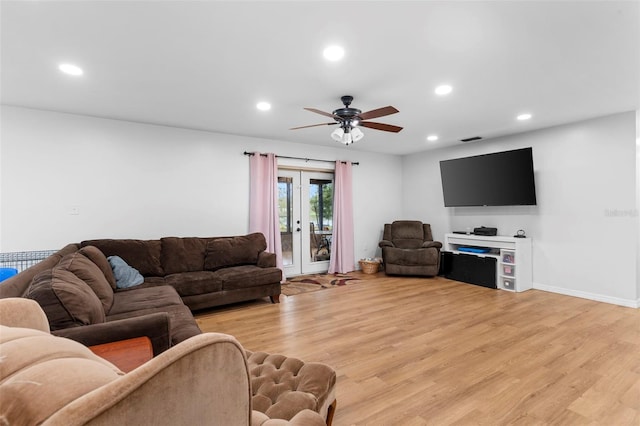 living area with recessed lighting, a ceiling fan, baseboards, light wood-style floors, and french doors