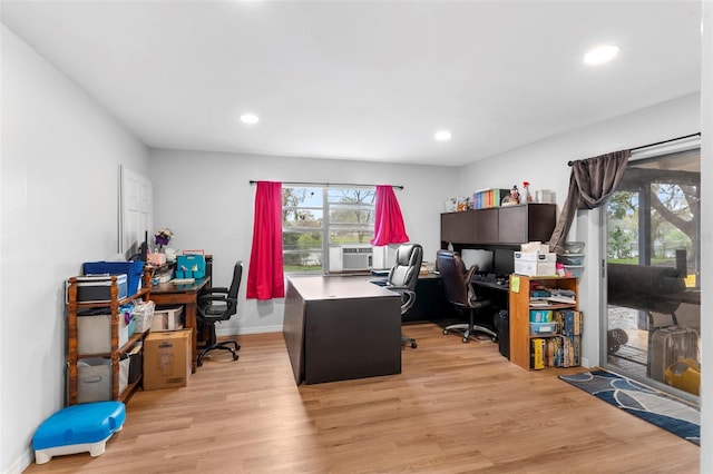 office space featuring light wood-type flooring, baseboards, cooling unit, and recessed lighting