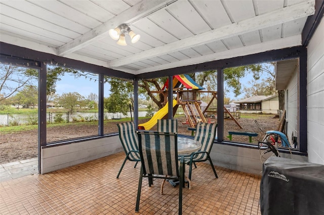 sunroom with beam ceiling